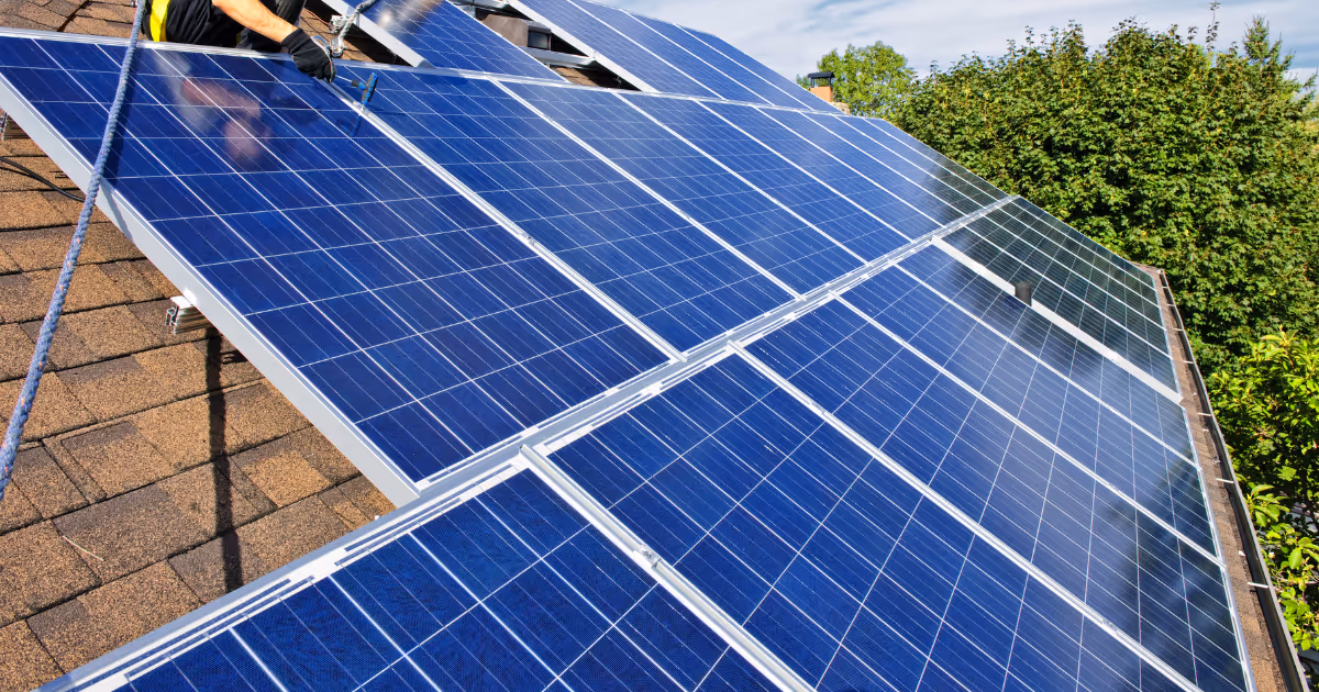 Blue solar panels on roof of house