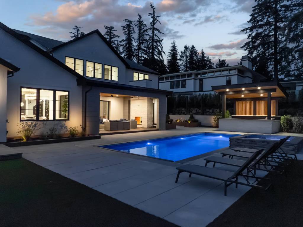 A poolside Oregan home shown as an example of a professional stucco exterior.