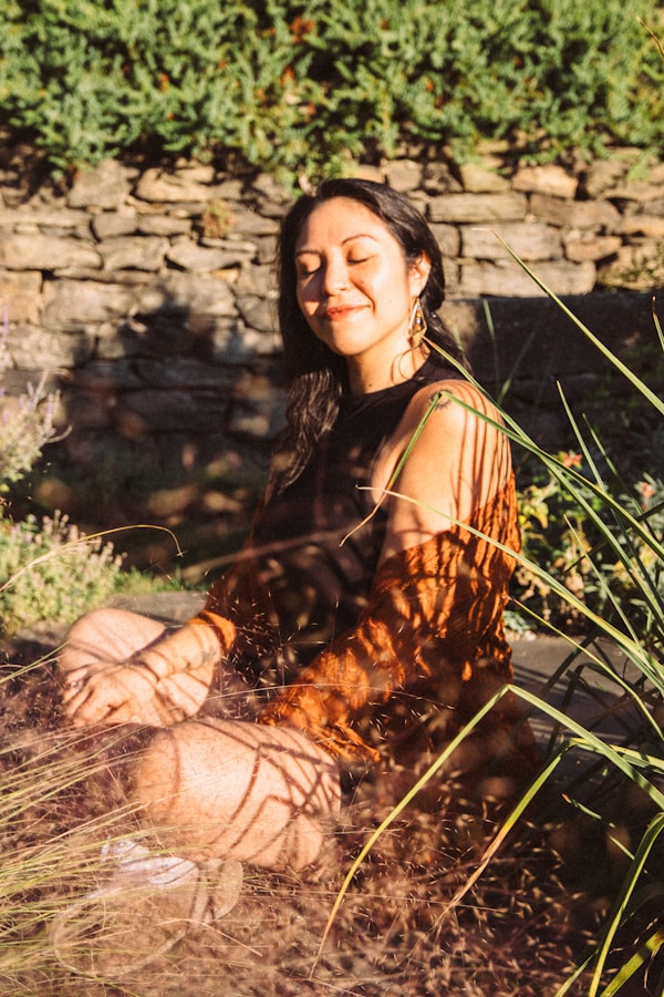 My friend smiling with her eyes closed as the sunsets over the Hudson at Wavehill Garden in the Bronx.