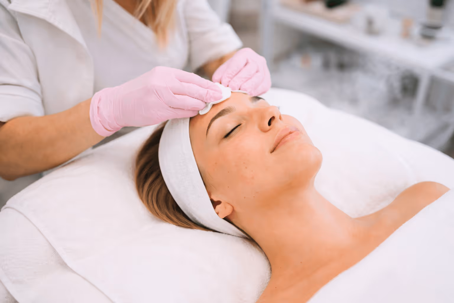 Esthetician performing a professional acne facial treatment in Trinity, Florida medical spa to reduce breakouts and calm inflamed skin.