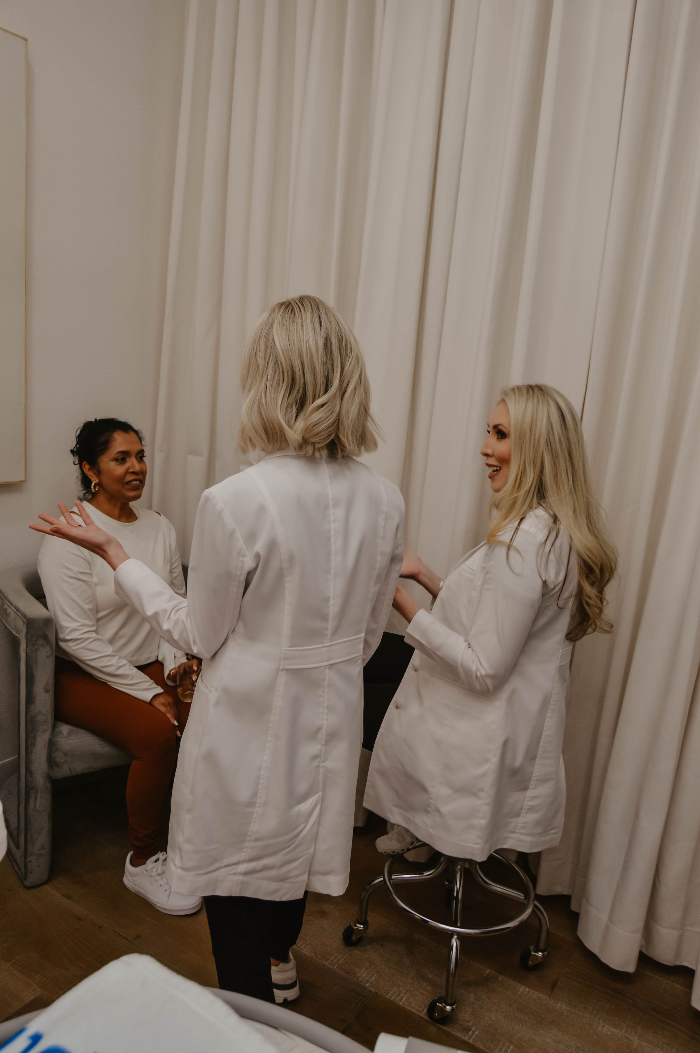 Woman consulting with aesthetician about body contouring candidacy in Trinity, Florida