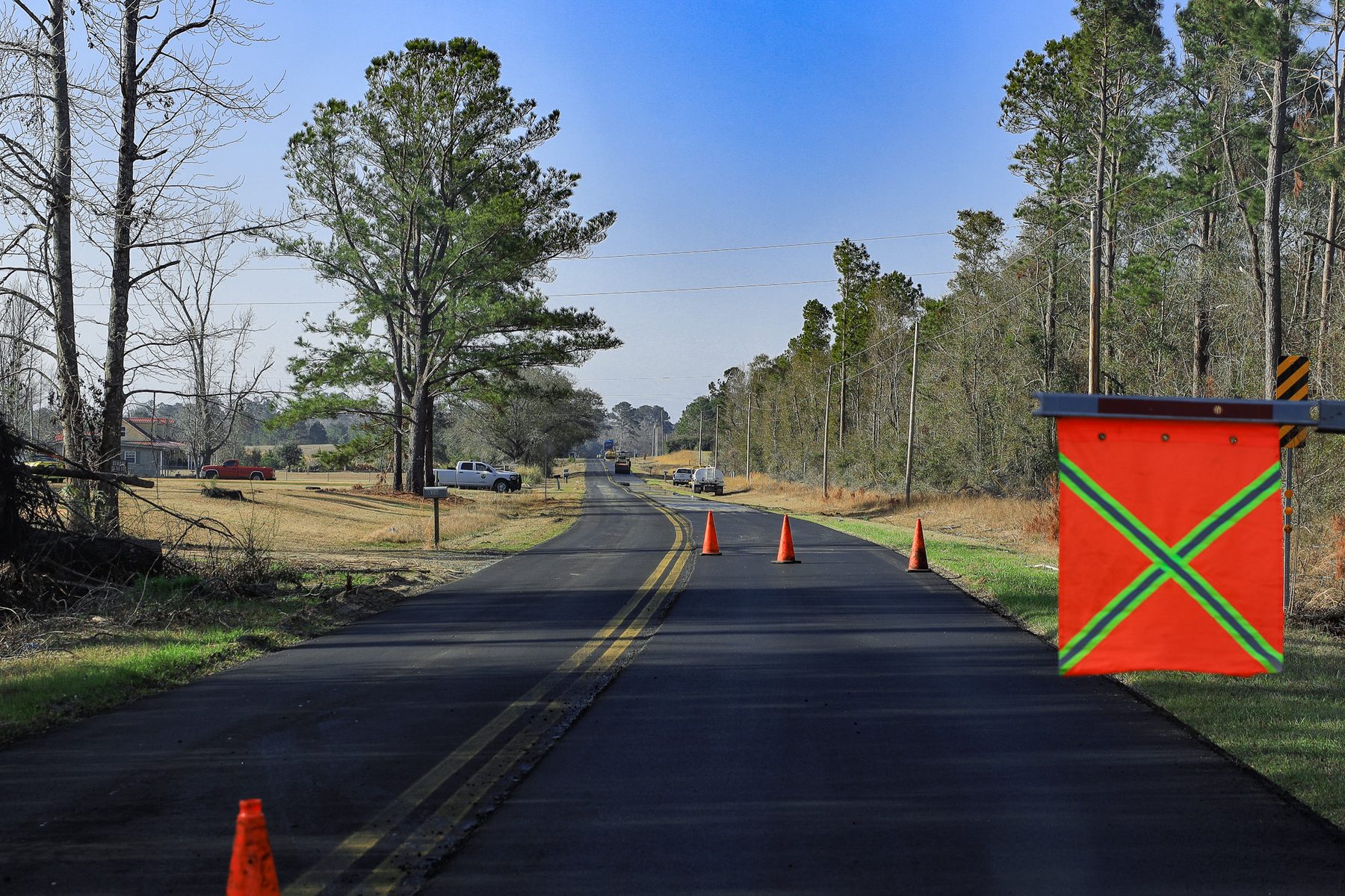 Traffic control setup with cones and a warning flag on Griffin Ferry Rd.