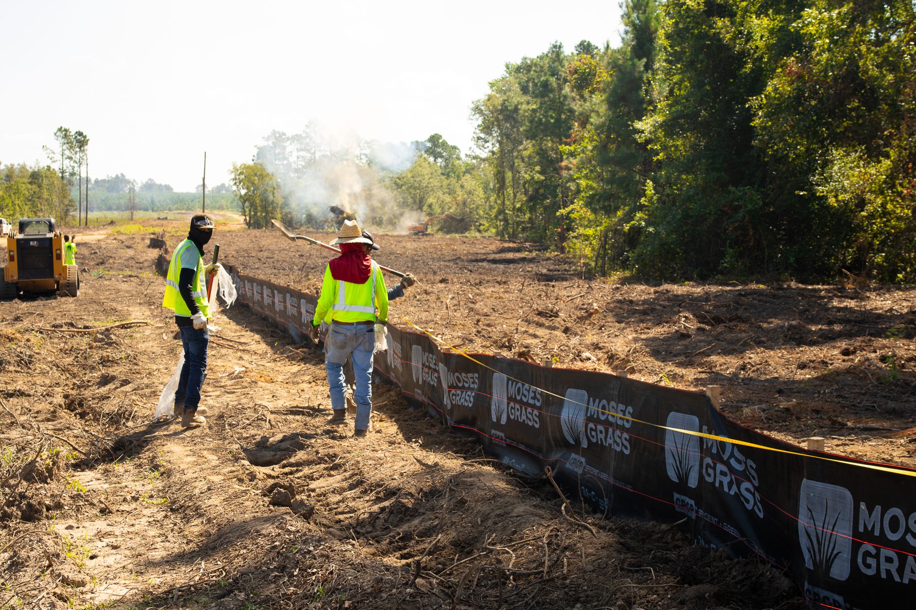 **Alt Text:** Crews are installing a silt fence along Hammond Church Rd in Lyons, GA, preparing the site for temporary and permanent grassing to prevent erosion. The team prioritizes safety and responsible land stewardship while enhancin...