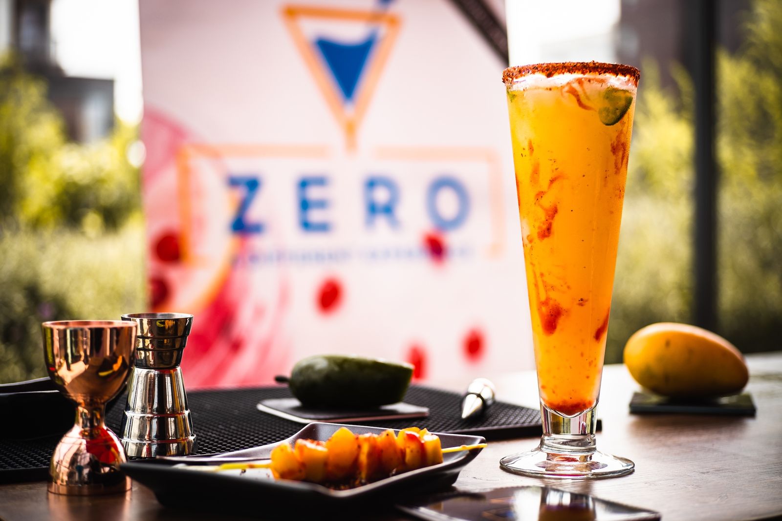 Zero Bar Logo background at a event with a non-Alcoholic drink and some food