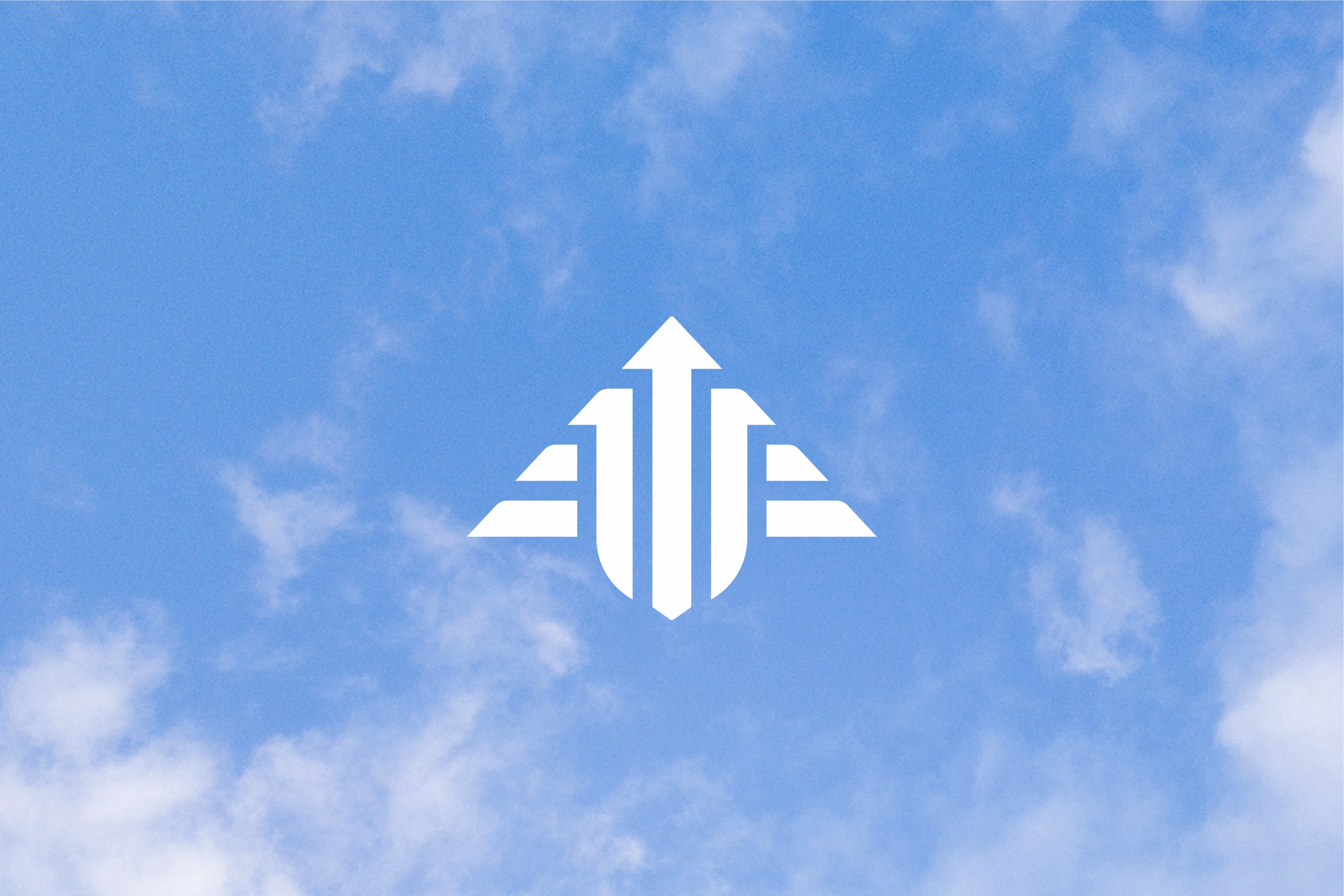 SCAC arrowhead logo in white with a blue sky and clouds in the background.