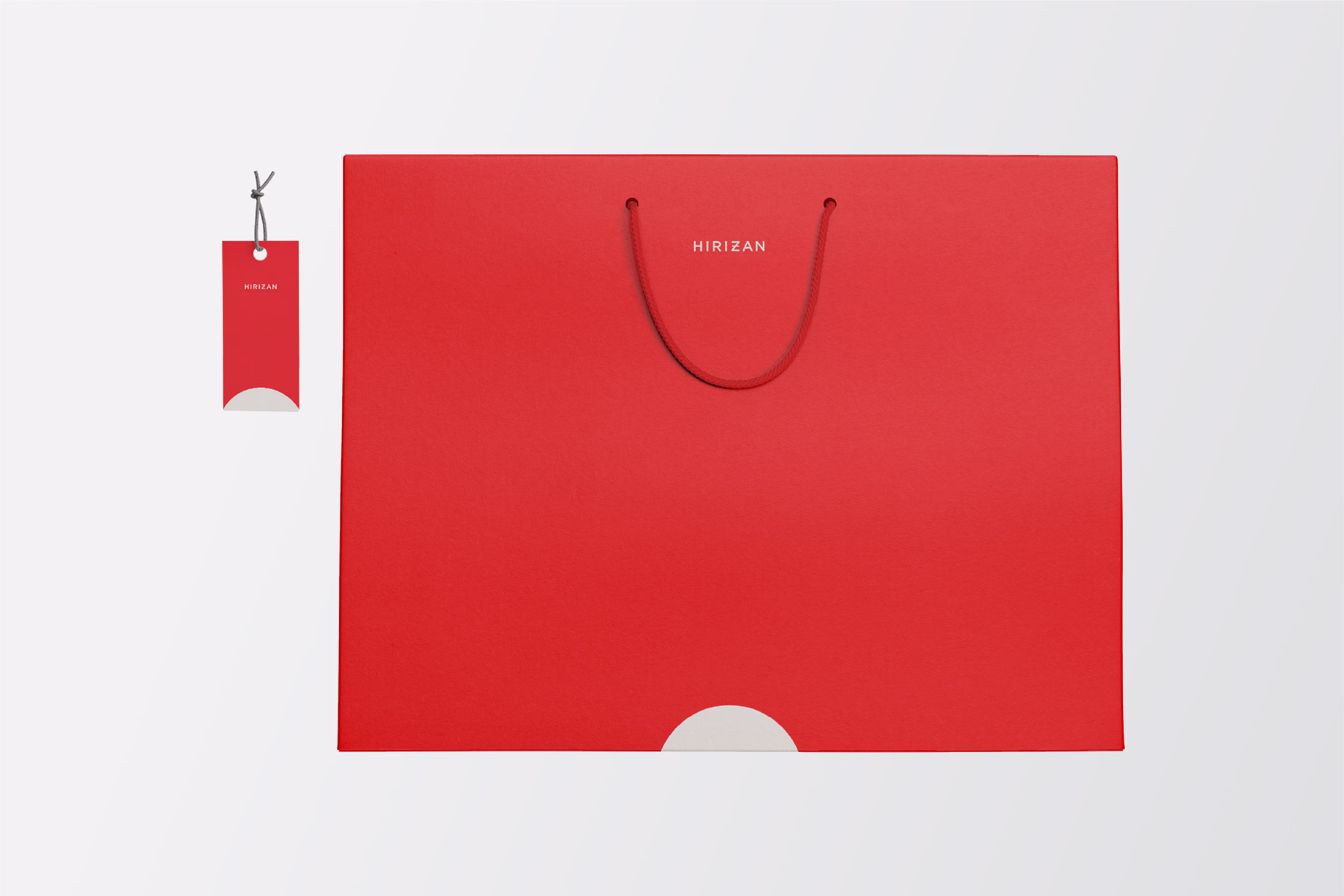Red shopping bag and clothing tag.