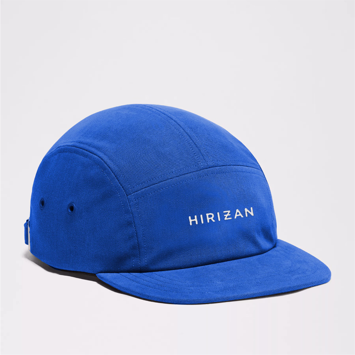 Angled product shot of a blue hat.