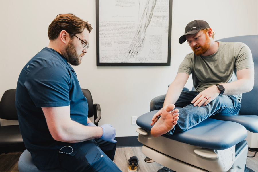 Podiatrist examining a patient’s foot during a foot and ankle appointment at Idaho Foot & Ankle Center.