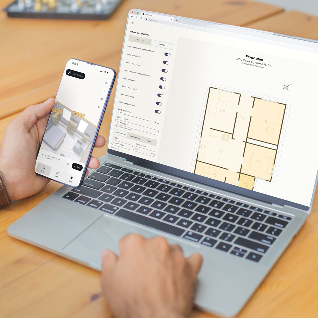 Person holding smartphone showing 3D floorplan view next to laptop displaying 2D floorplan in Polycam, both showing the same property layout