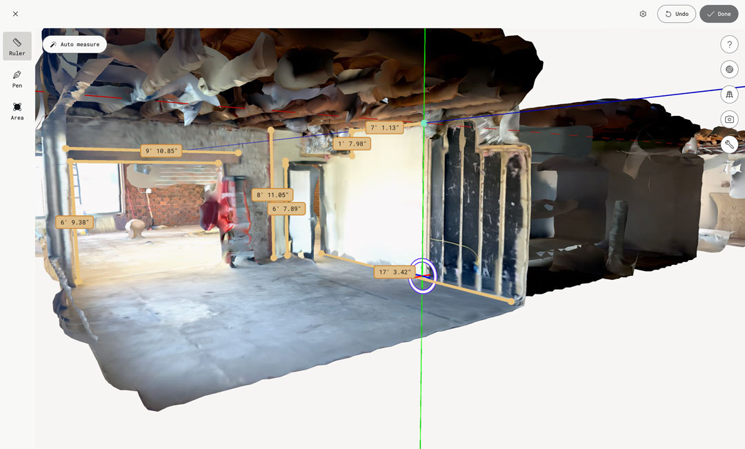 A 3D scan in Polycam of a partially demolished space. UI shows measurements throughout the space.