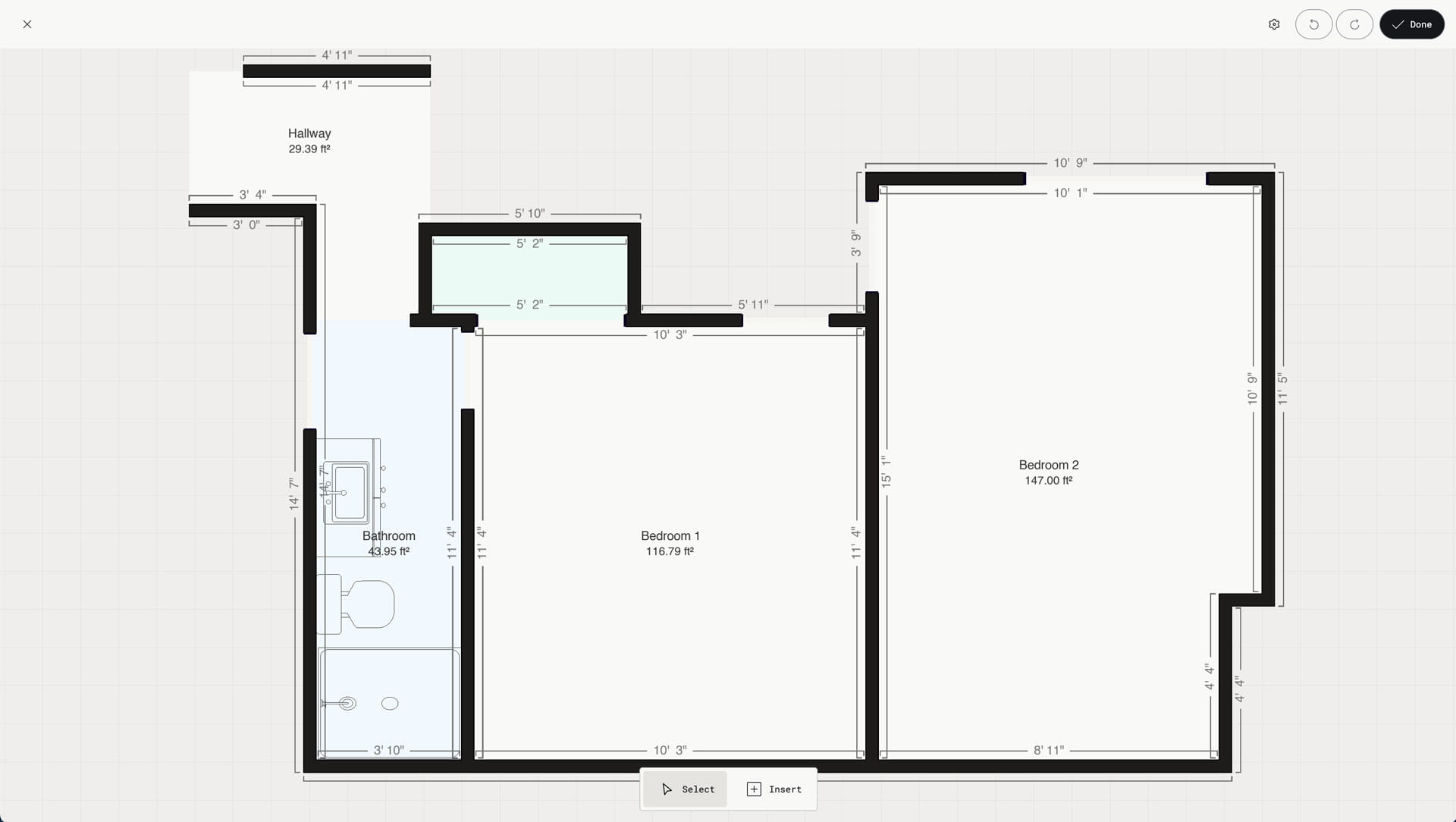 Editable floor plan created from a 3D scan in the Polycam app interface, showing a two-bedroom layout with hallway and bathroom. The architectural drawing displays dimension annotations and room labels throughout. The Polycam UI features Select and Insert 