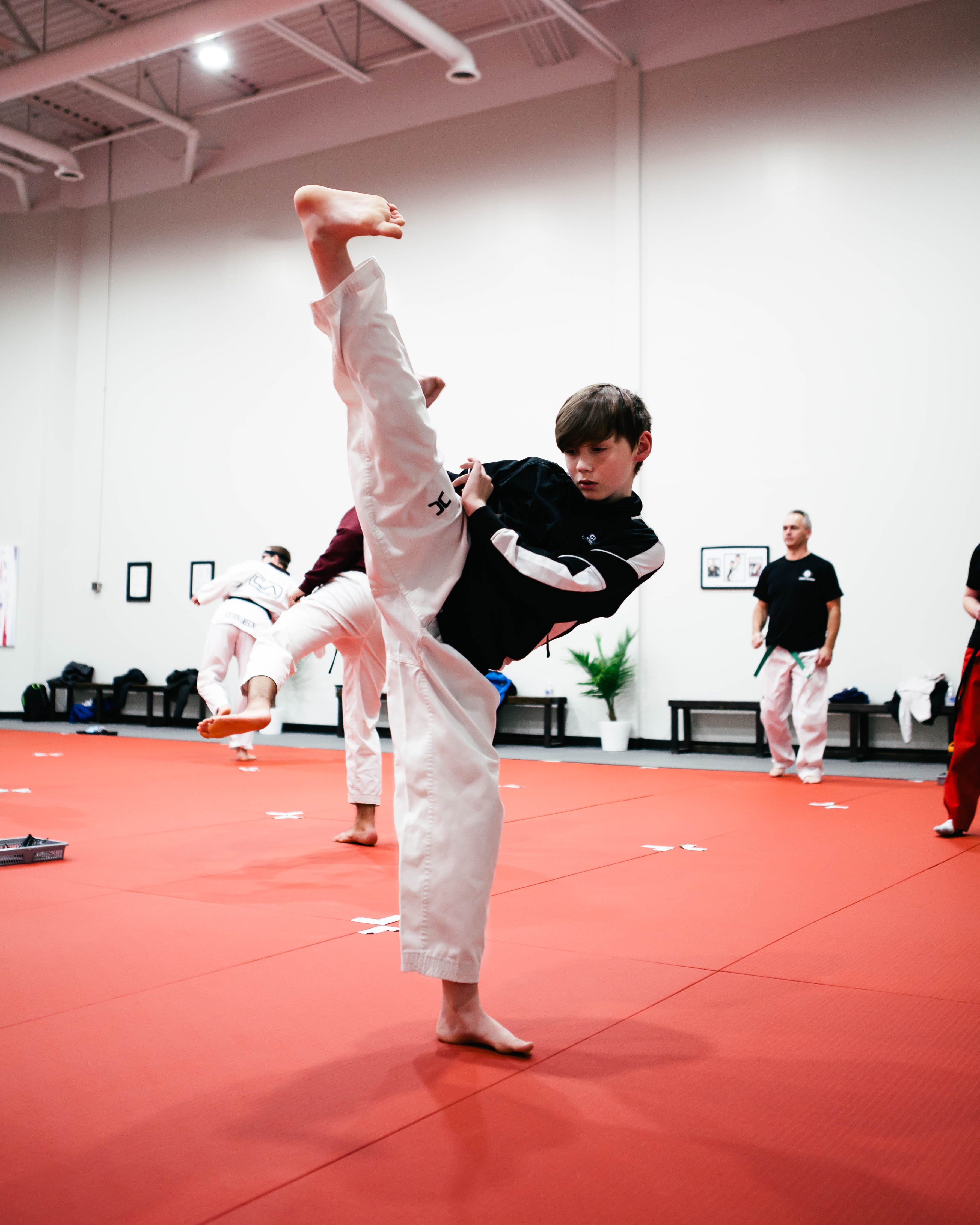 A kid learning Taekwondo