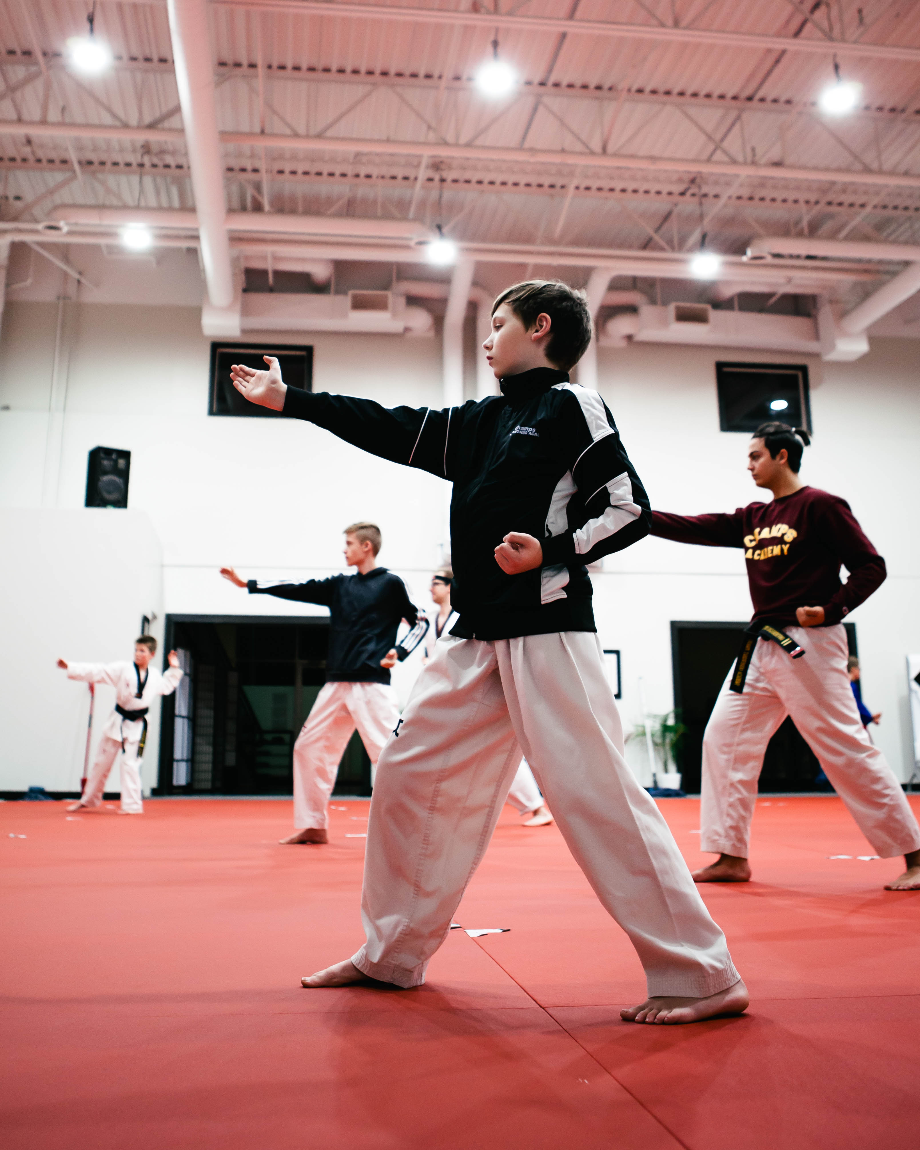 3 teenagers training Taekwondo