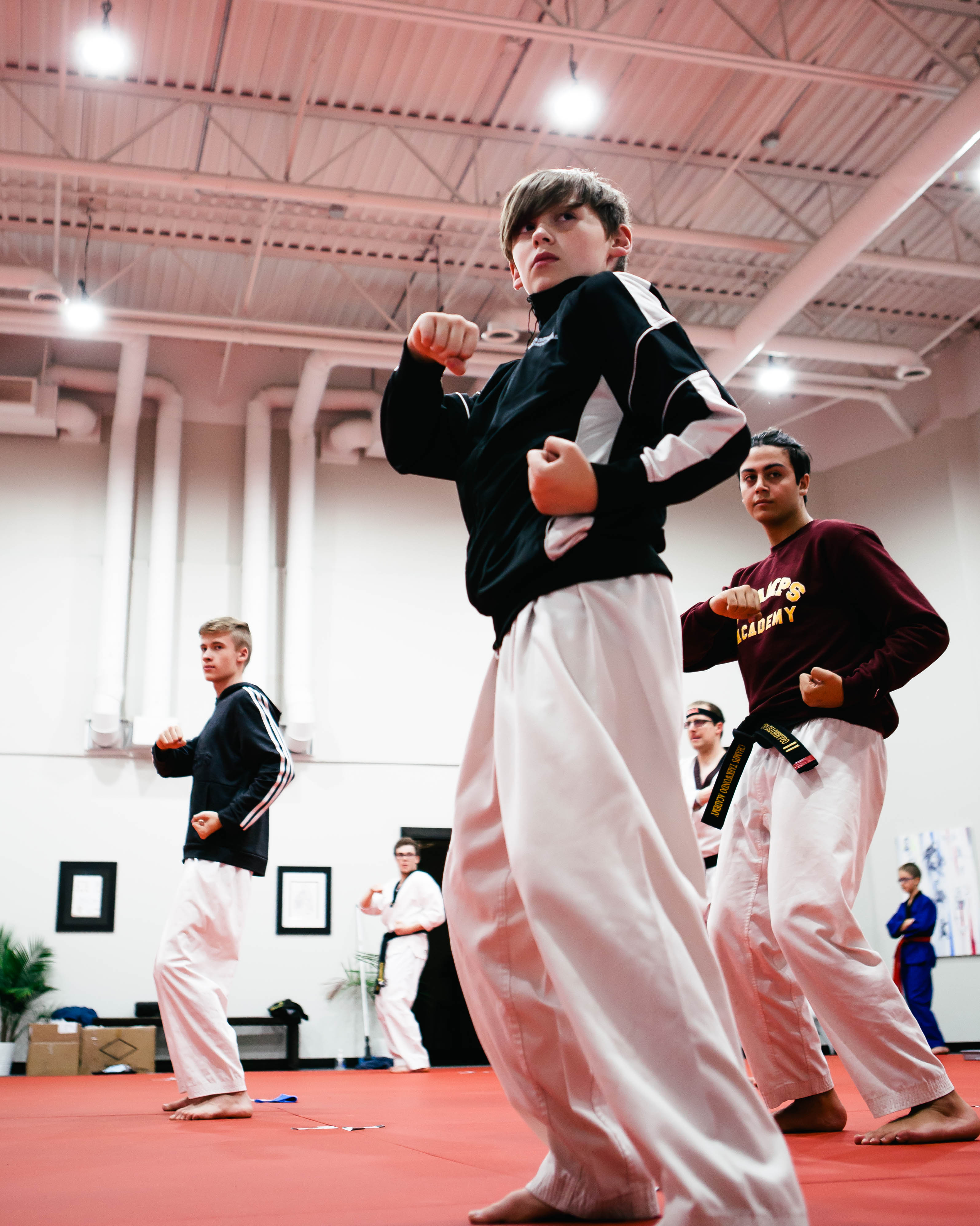 3 teenagers training Taekwondo