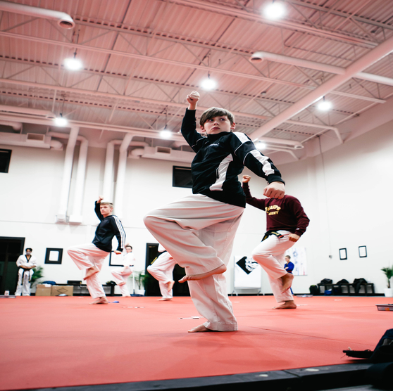 A kid learning Taekwondo