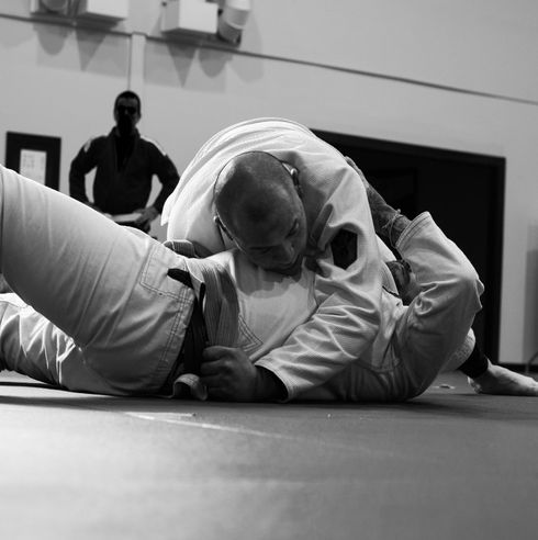 Two Adults doing brazilian jiu jitsu