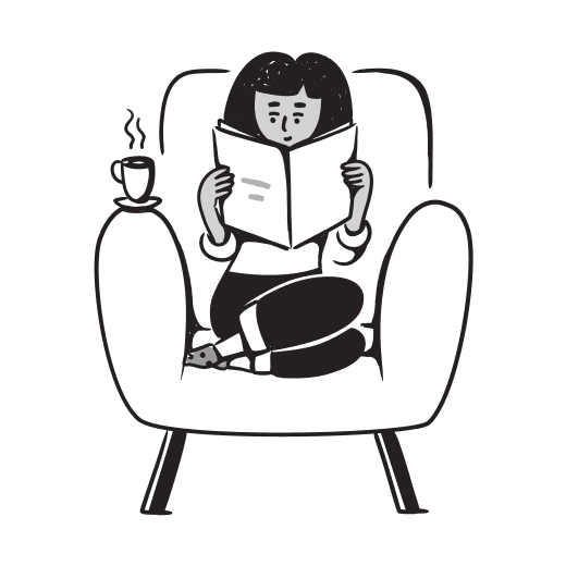 A woman reading a book while sitting relaxed on the sofa