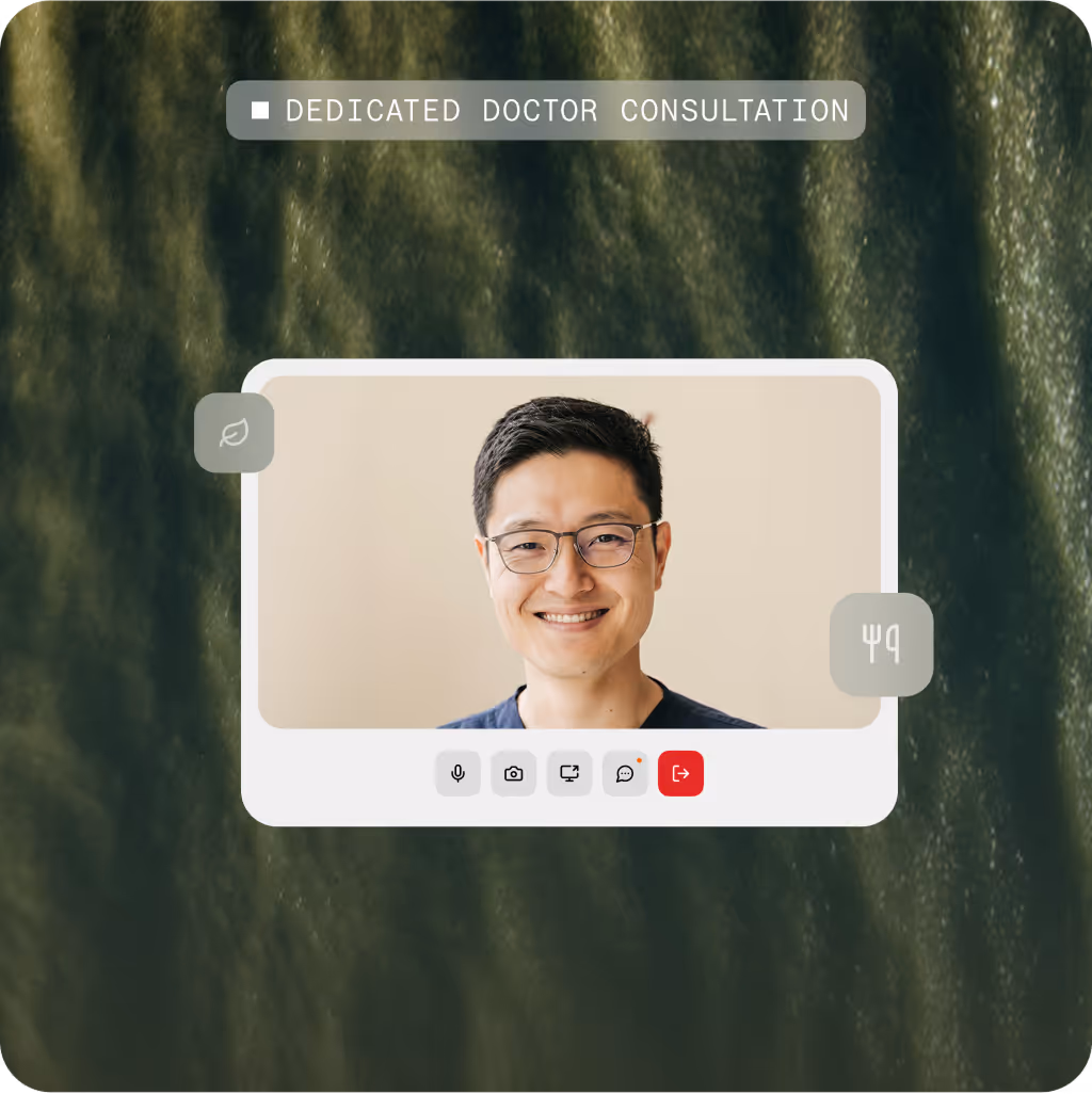 Smiling man with glasses during a virtual dedicated doctor consultation on a video call interface.