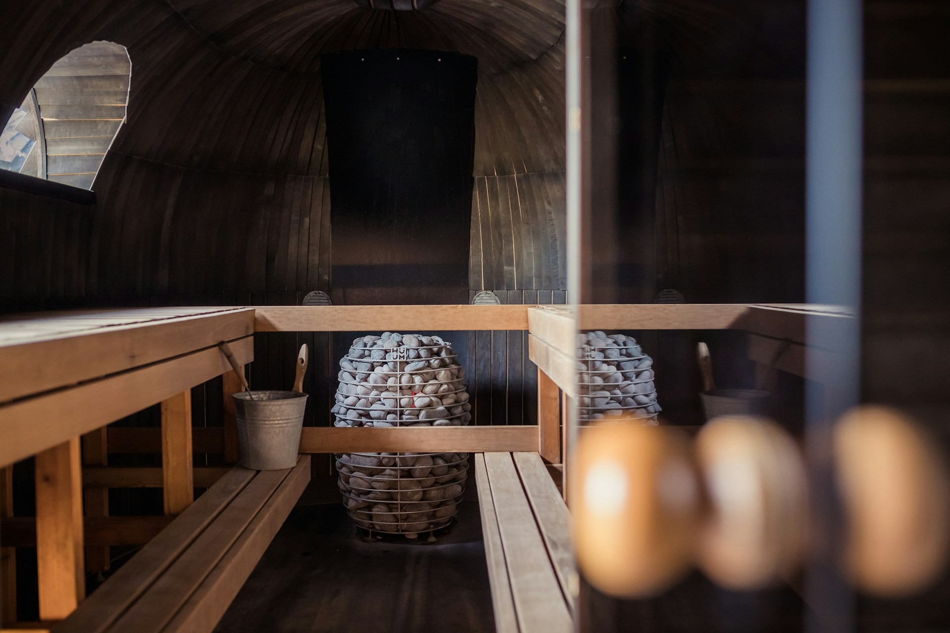 Brain Performance Neurofeedback Centers sauna with hot stones and wooden benches