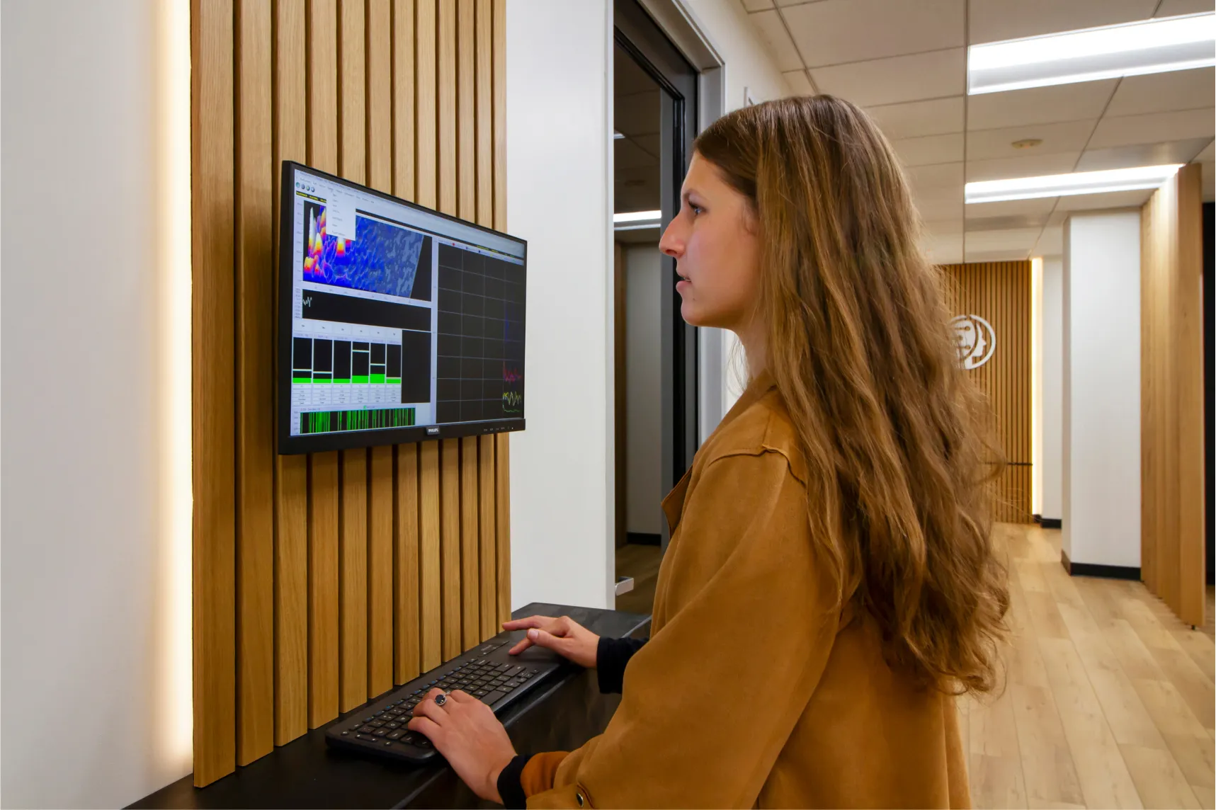 Brain Performance Neurofeedback Centers analyze complex brain data on monitor