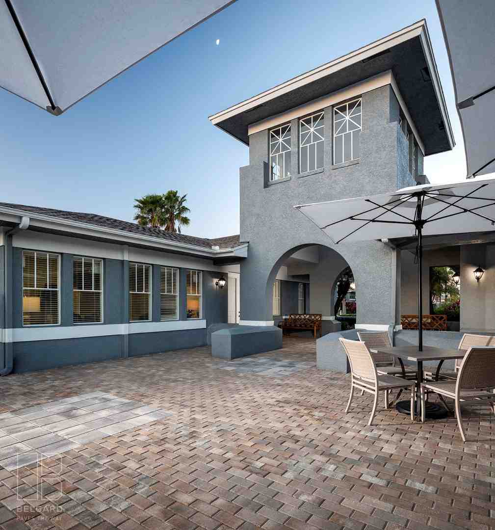 family enjoying a meal prepared in their beautiful outdoor kitchen - backyard cooking space groveland family enjoying a meal prepared in their beautiful outdoor kitchen - backyard cooking space groveland