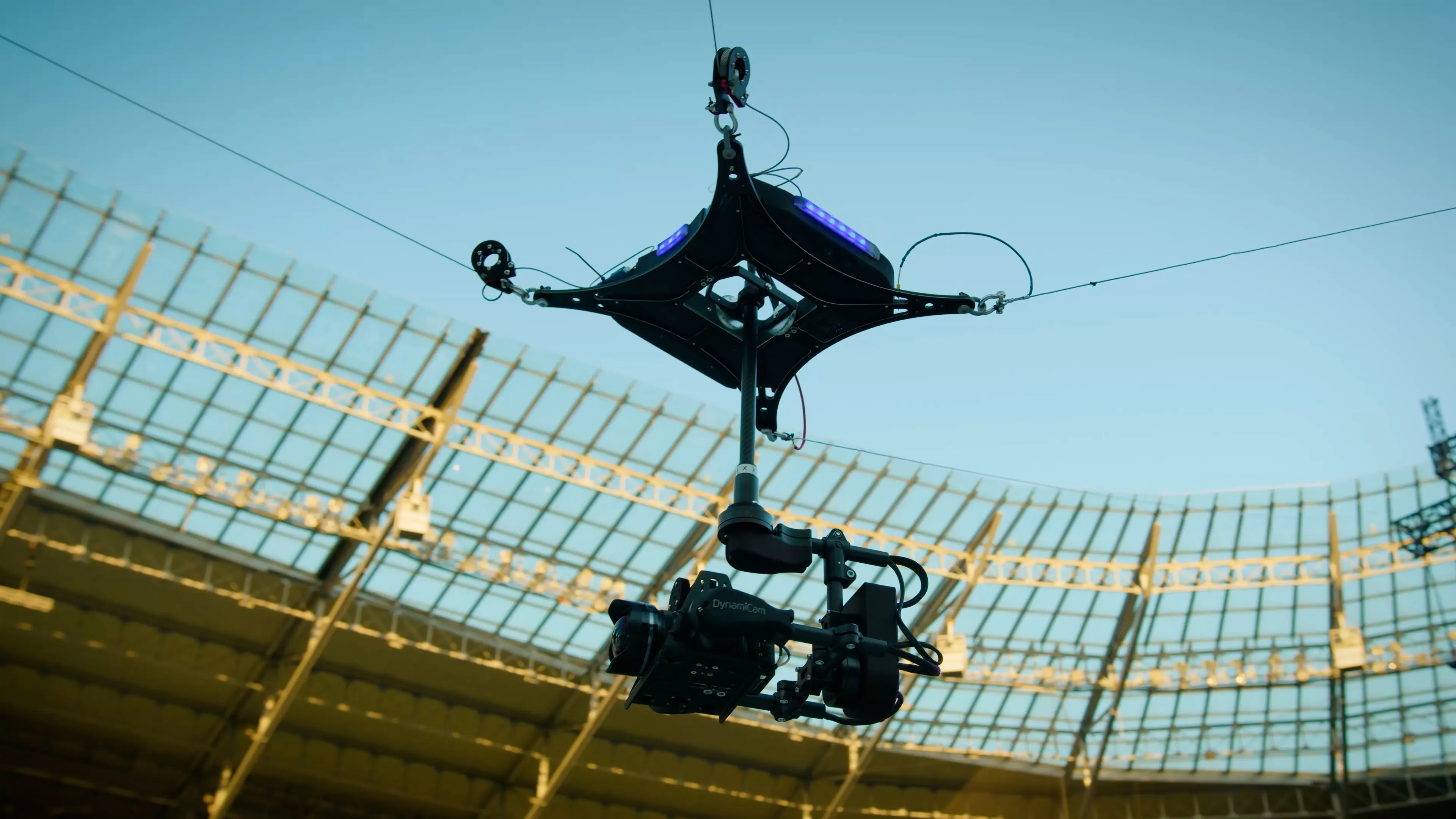 Spider-cam rig inside a Tarczyński Arena Stadium during a ChwałaMU event.