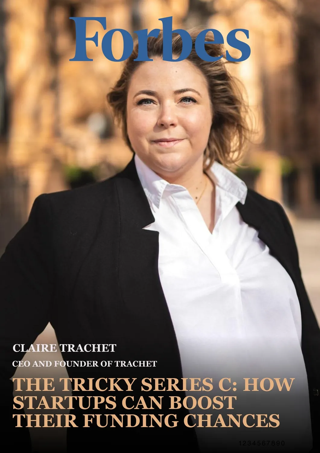 Portrait of Claire Trachet, CEO and founder of Trachet, wearing a black blazer over a white shirt, standing outdoors with a blurred warm-toned background, featured on Forbes cover with headline about boosting startup funding chances in Series C.