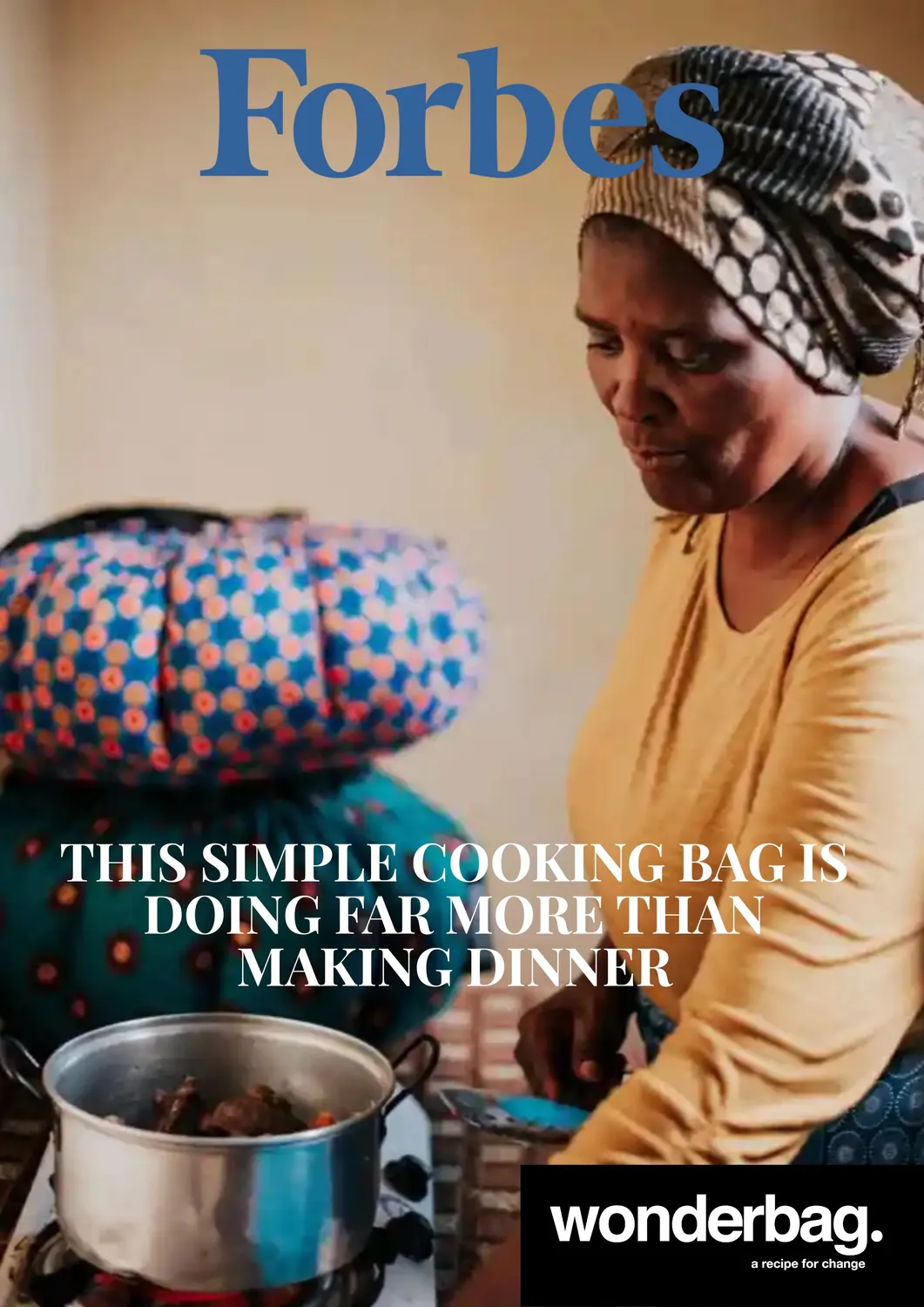 Woman wearing a patterned headscarf and yellow long-sleeve shirt cooking with a pot on a stove, with two colorful cooking bags stacked in the background; Forbes logo and text about a simple cooking bag making more than dinner, and a Wonderbag logo with the tagline 'a recipe for change.'