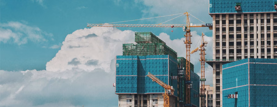 an image of tall buildings being constructed