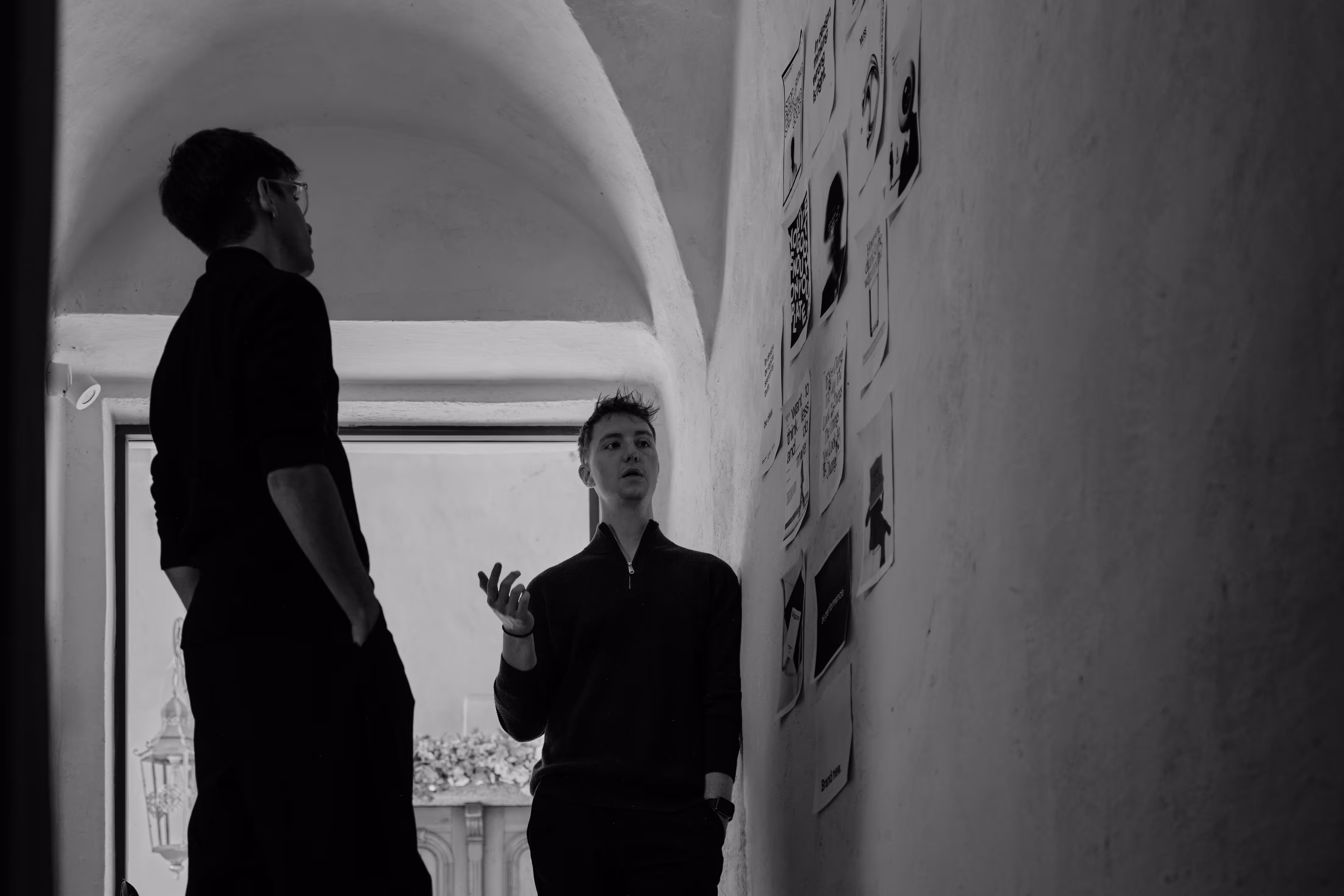 Paul and Alex loking at a wall with imaged