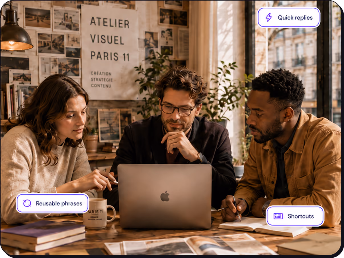 Three people looking at a laptop together in a cozy workspace with books and plants.