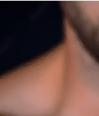 Abstract close-up with soft focus and warm skin tones against dark background