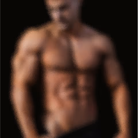 Muscular male fitness model showing defined abs - workout motivation concept