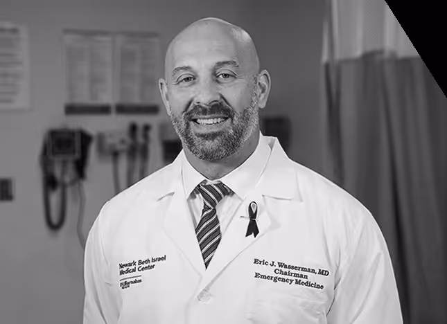 Smiling doctor in white coat with stethoscope promoting men's health awareness