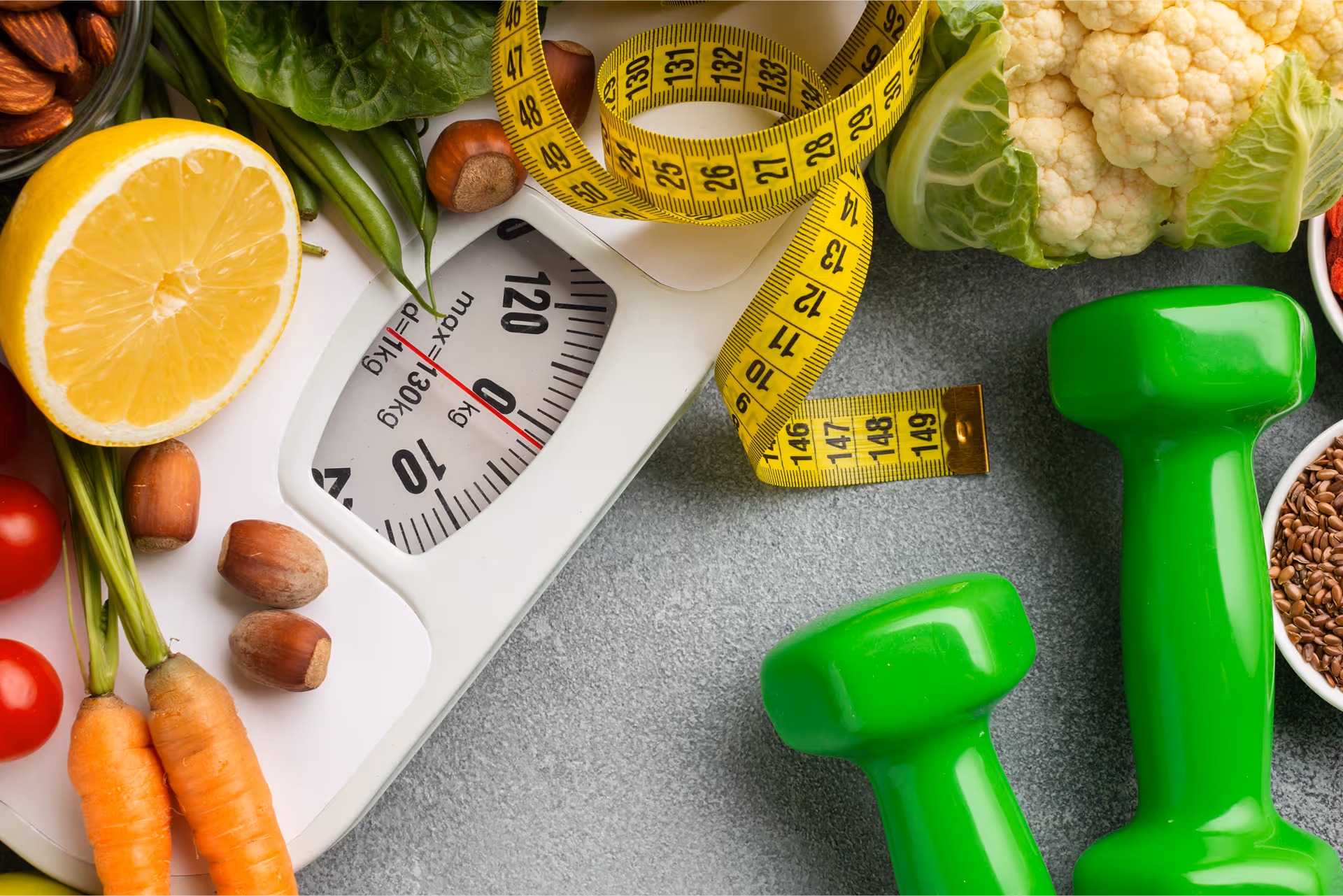 Healthy foods, scale, measuring tape and dumbbells for weight management