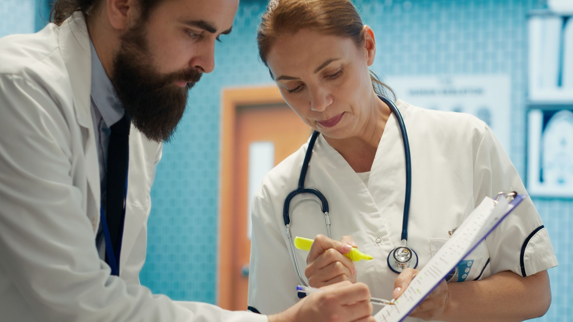 Healthcare professionals reviewing patient medical records and treatment plans