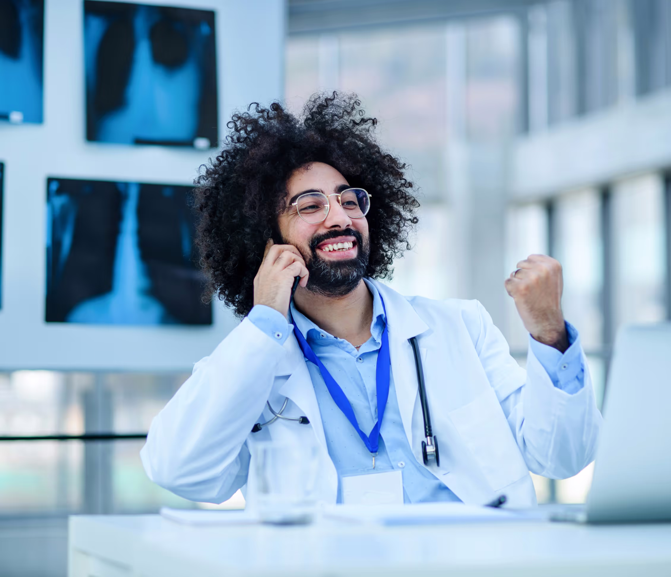 Happy doctor celebrates automated recall & reminder upsell booked by Adaptify AI receptionist