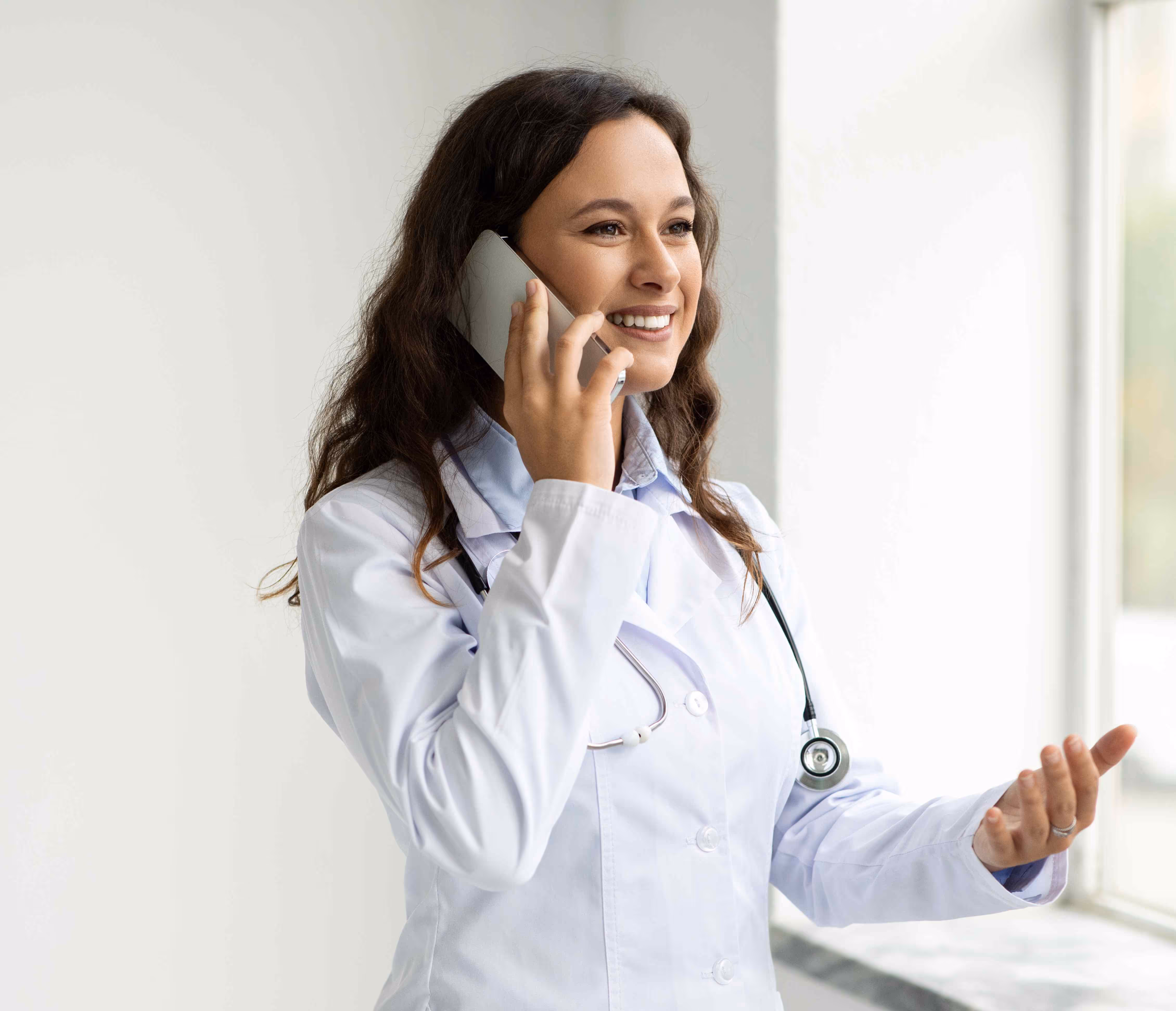 Female doctor on phone using Adaptify’s 24/7 HIPAA-compliant medical answering service for emergency patient triage
