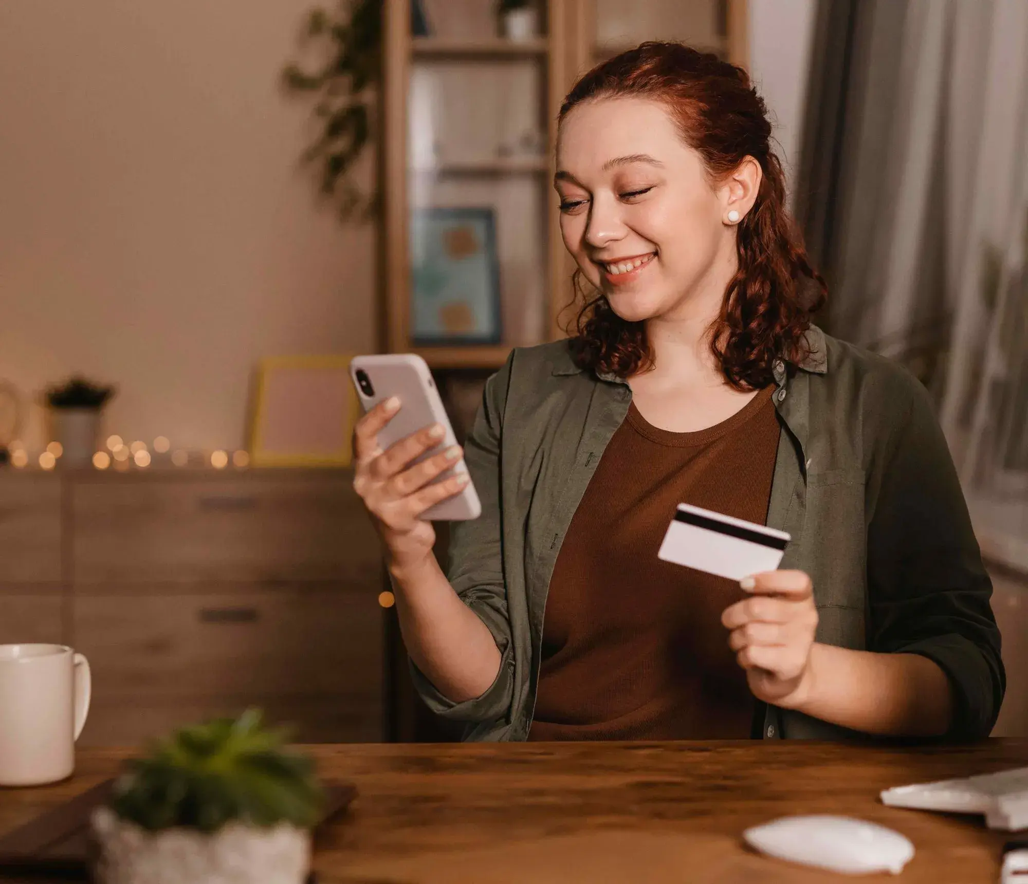 Customer reviews pay-as-you-grow AI receptionist pricing on phone while holding credit card—no hidden fees.