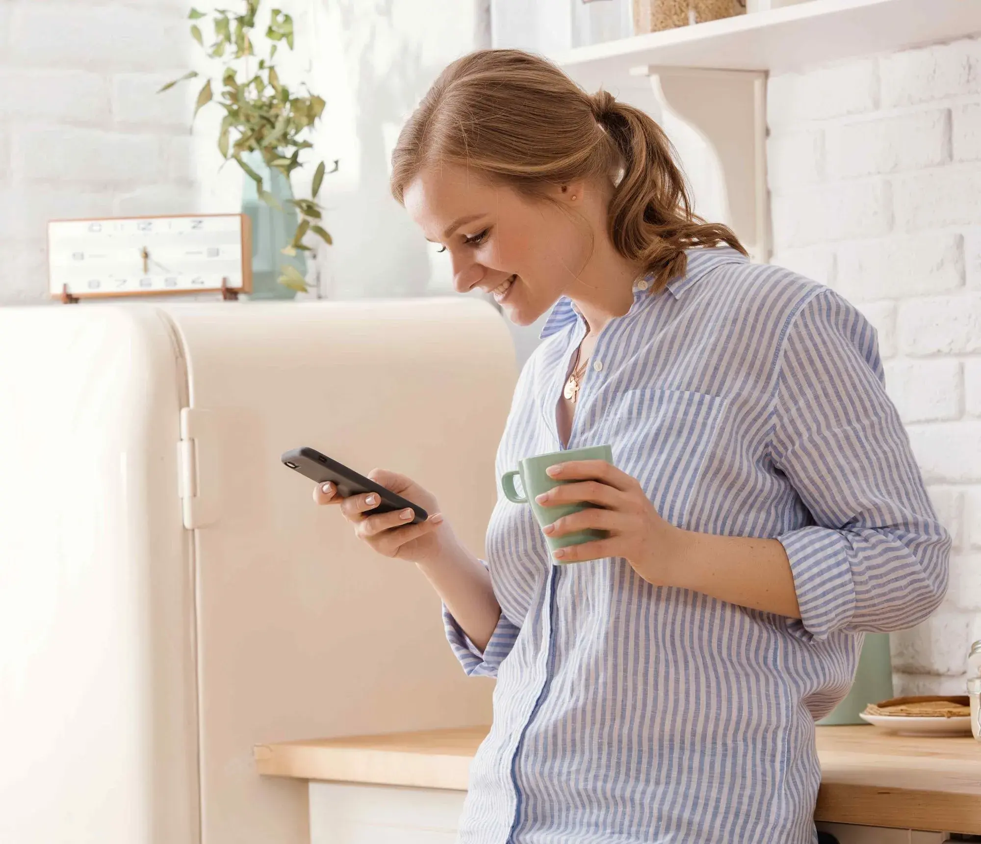 Homeowner reading Adaptify missed-call SMS to book an AC repair slot