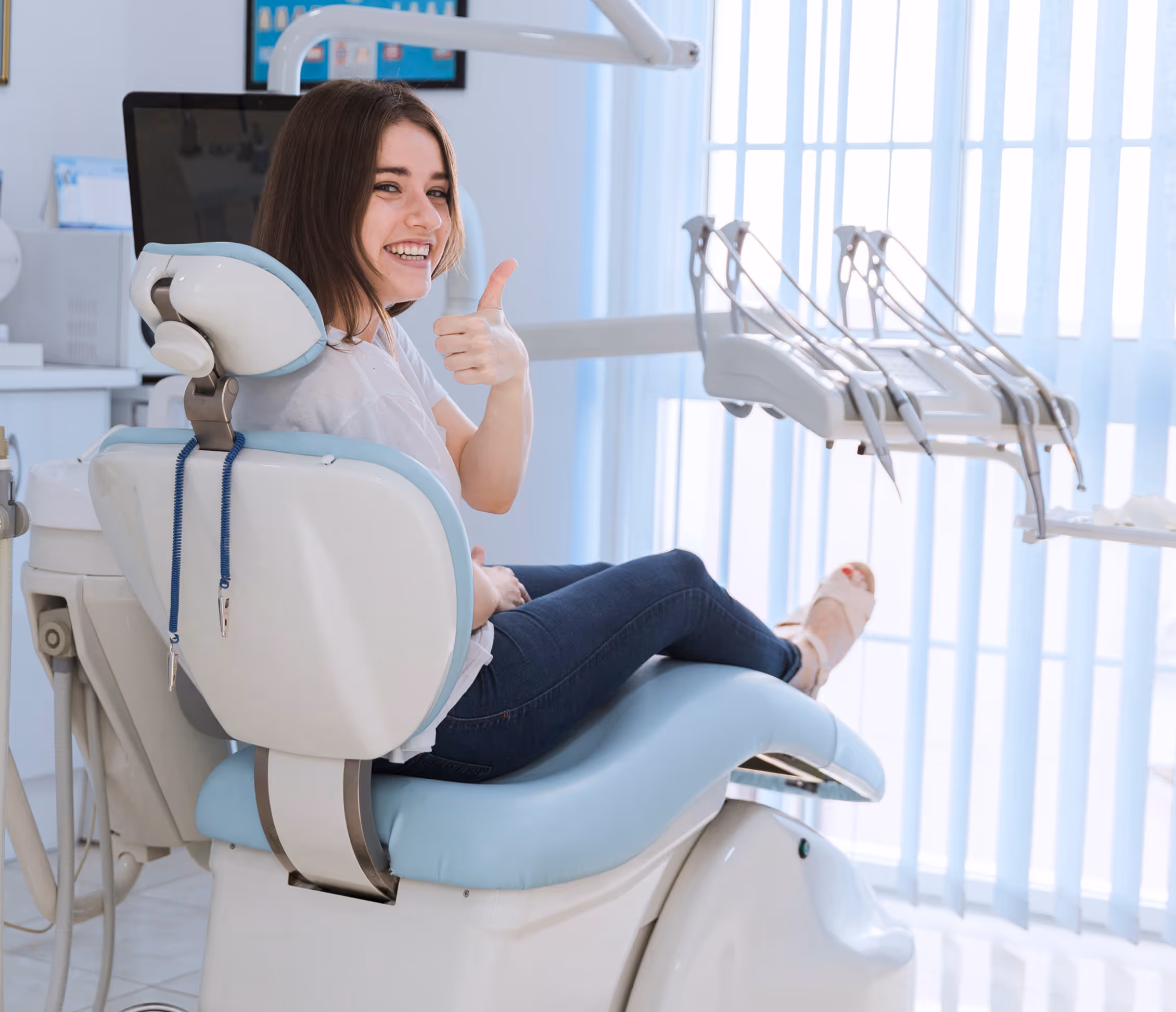 Satisfied patient giving thumbs-up after accepting an automated six-month hygiene reminder