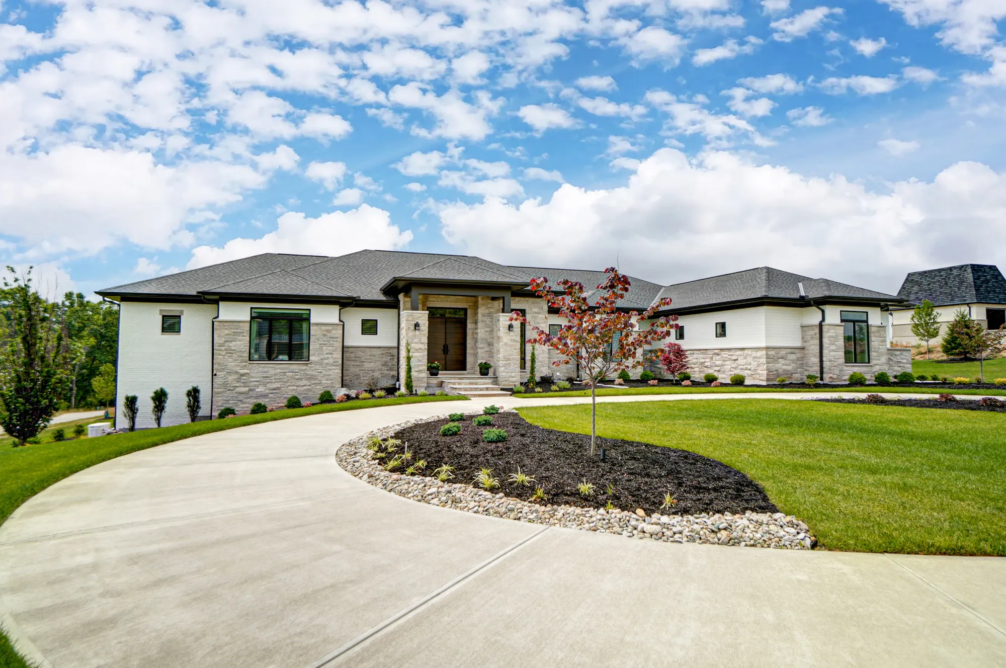 Custom-built luxury home in Montgomery, Ohio with circular driveway by Classic Living Homes