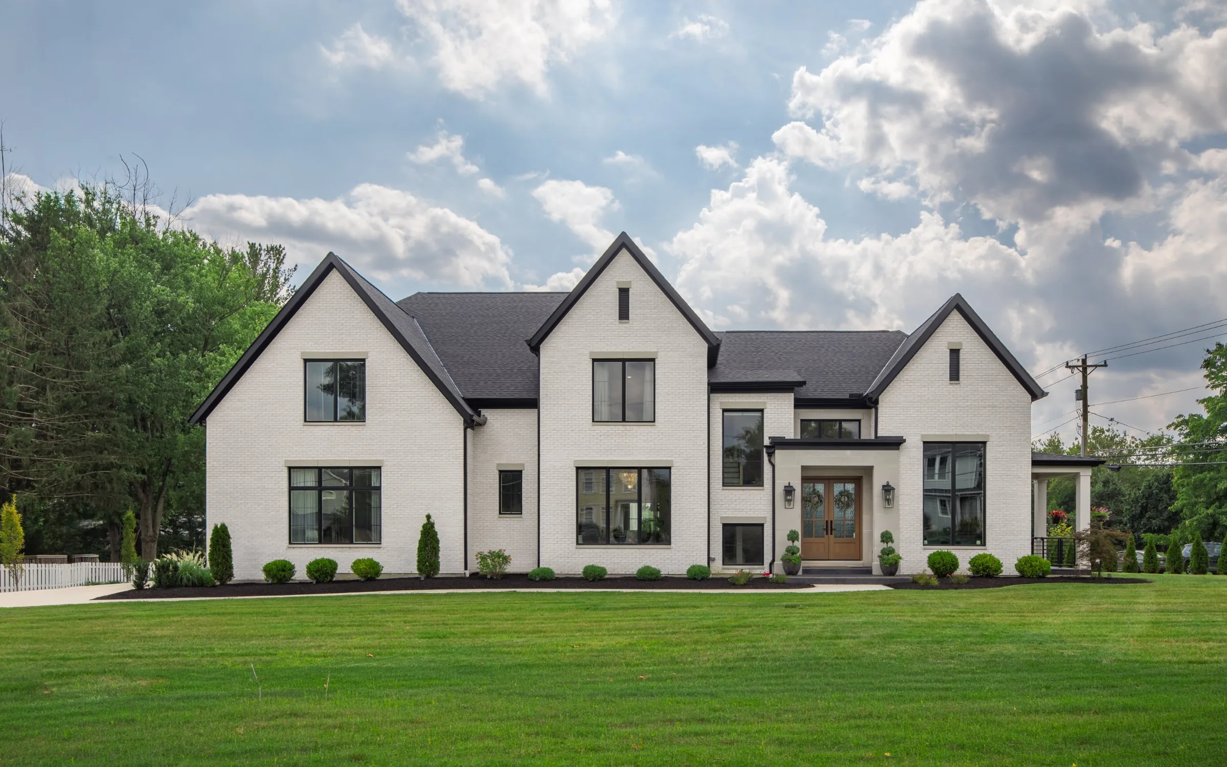 Two-story white brick custom home by Classic Living Homes on Remington Road in Montgomery, Ohio
