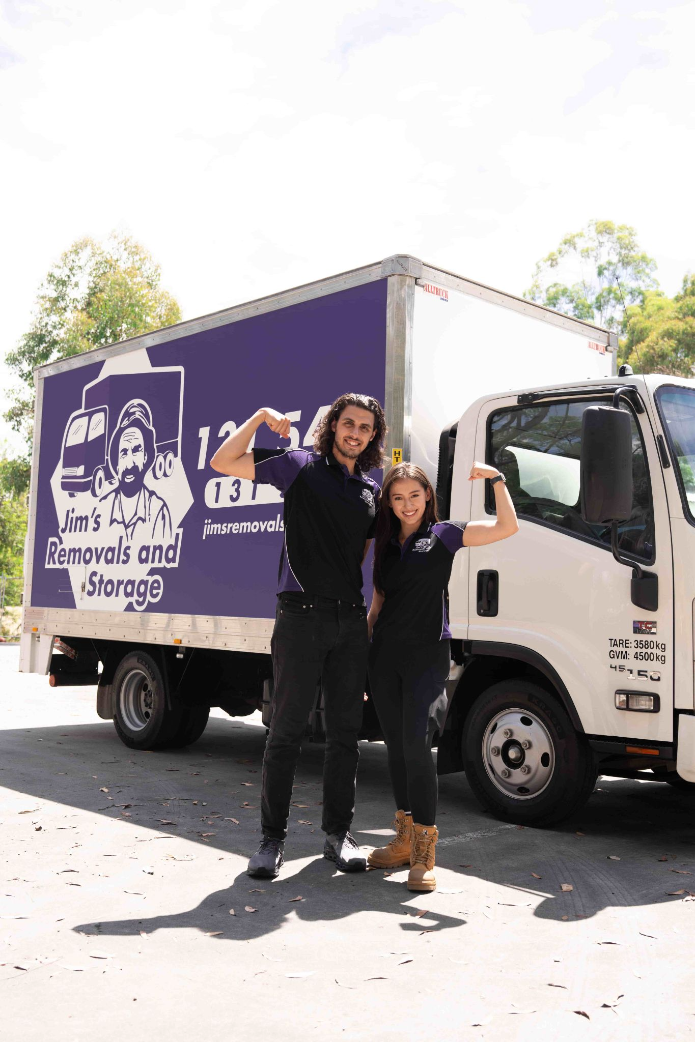 Jim's Removals movers with their arms in a flexed position