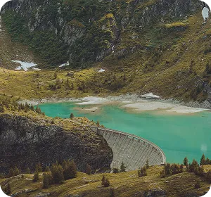 A large lake surrounded by mountains and trees.