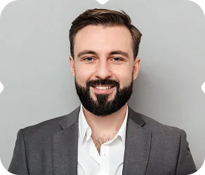 A man with a beard wearing a suit.