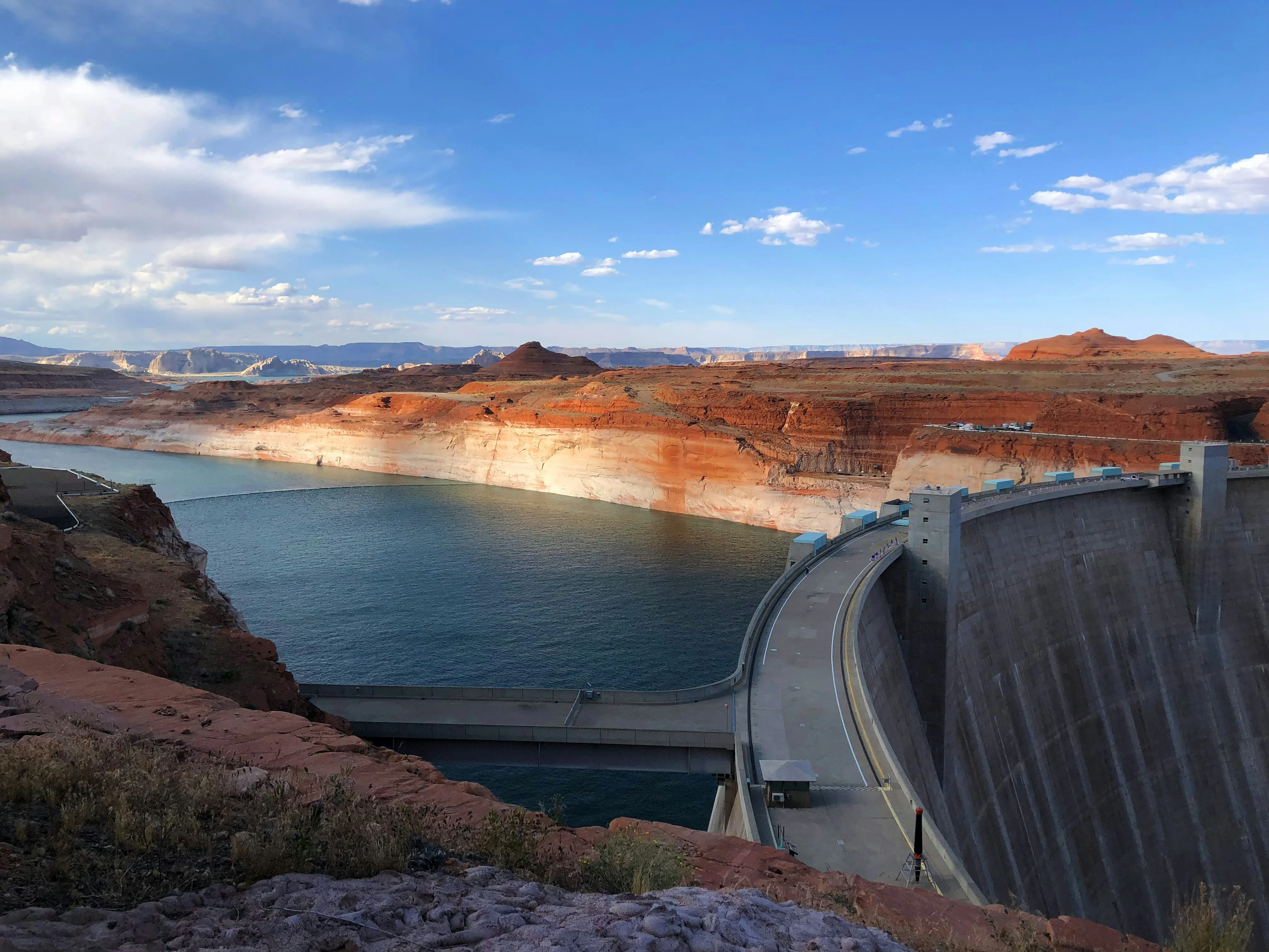 A large body of water surrounded by mountains.