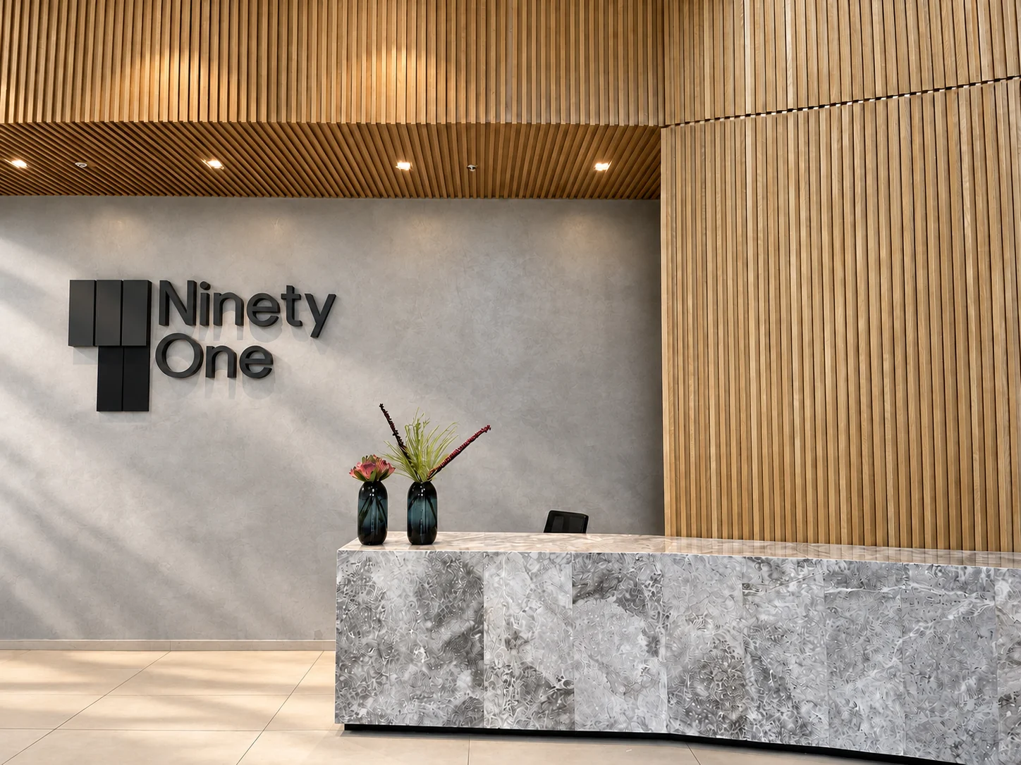 Ninety One reception with wall signage and marble desk