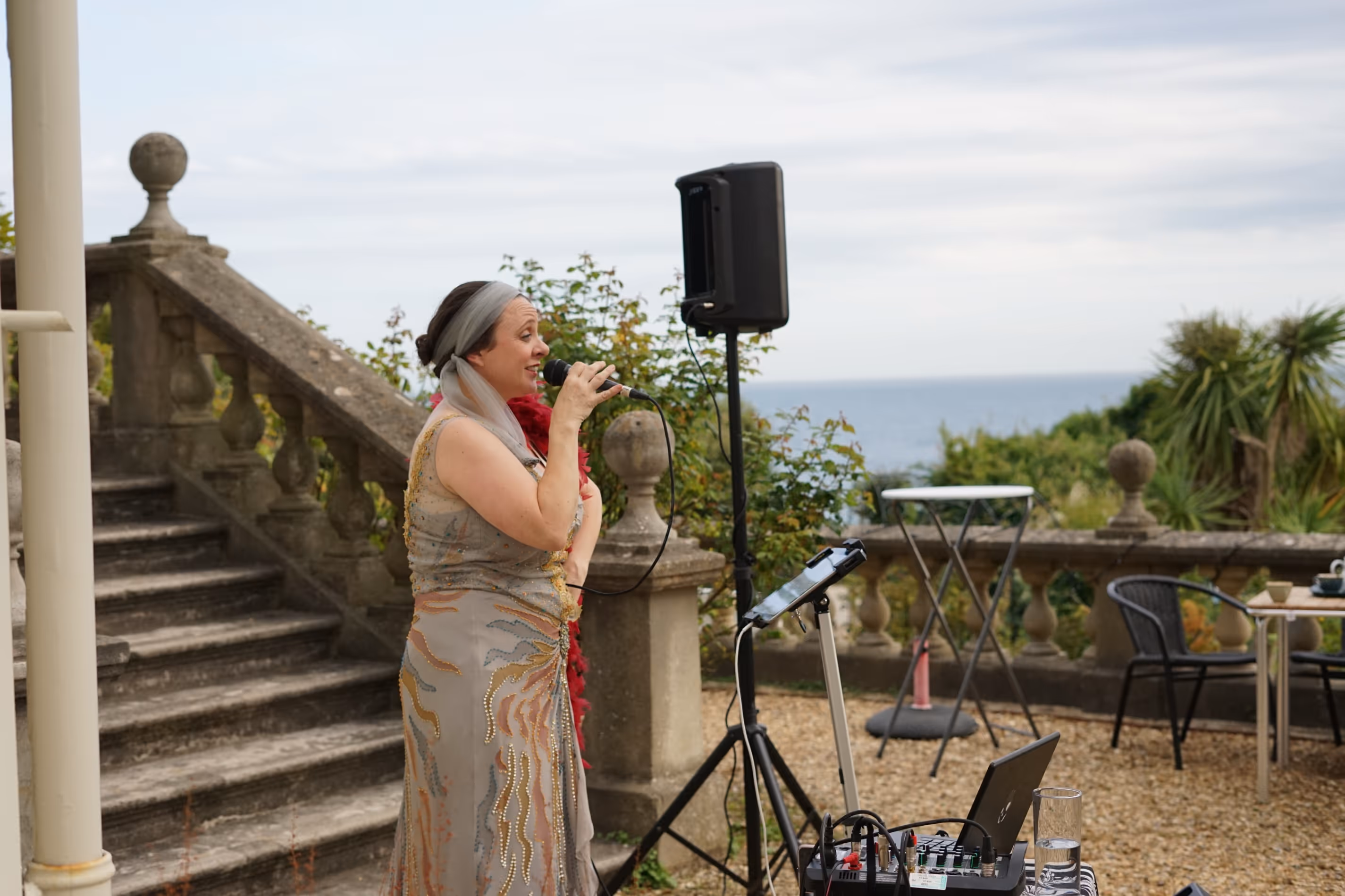 Singer on Museum Terrace with sea views in background