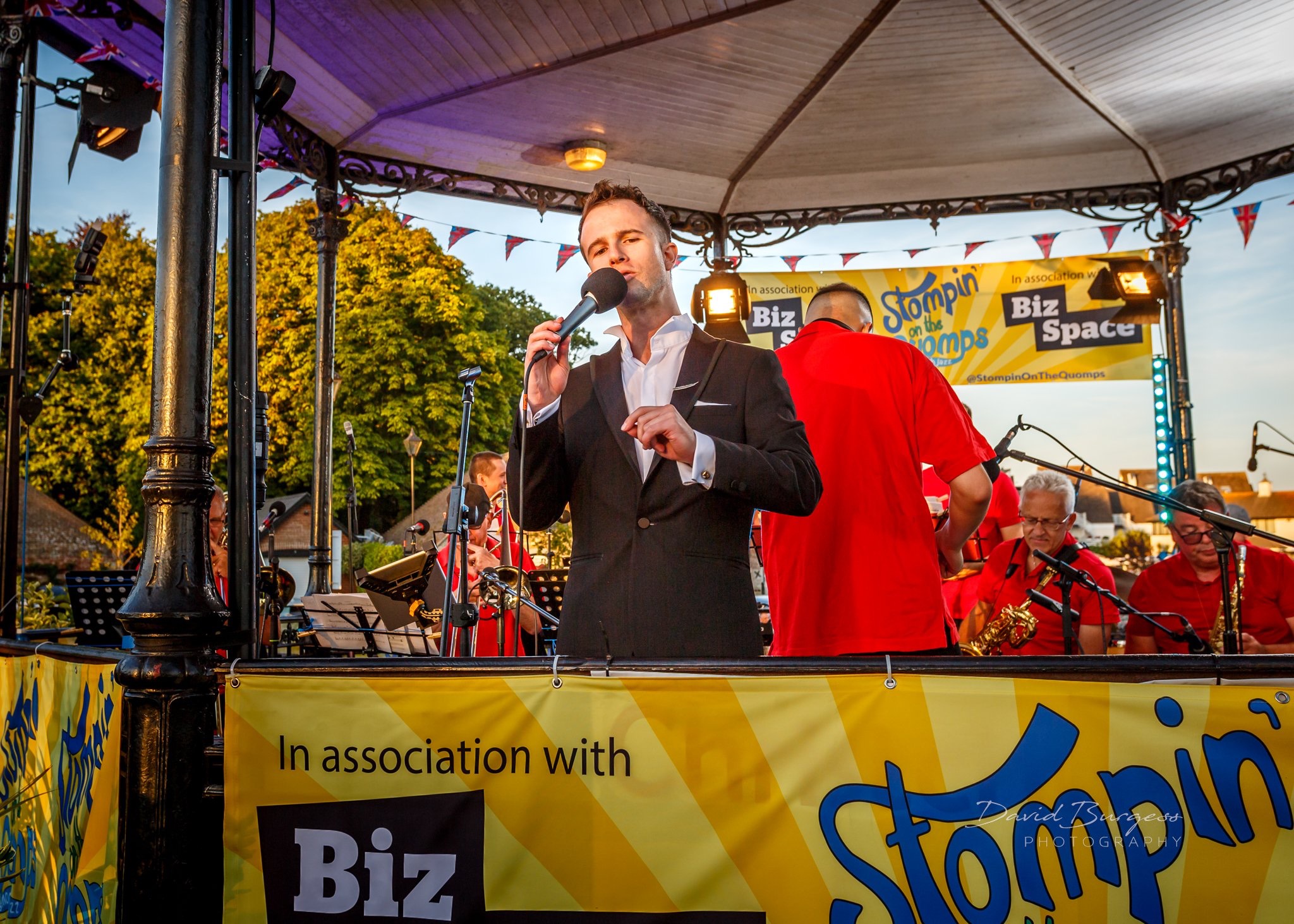 Sam Merrick Singing in front of Big Band at Stompin' on the Quomps - Image Credit: David Burgess Photography